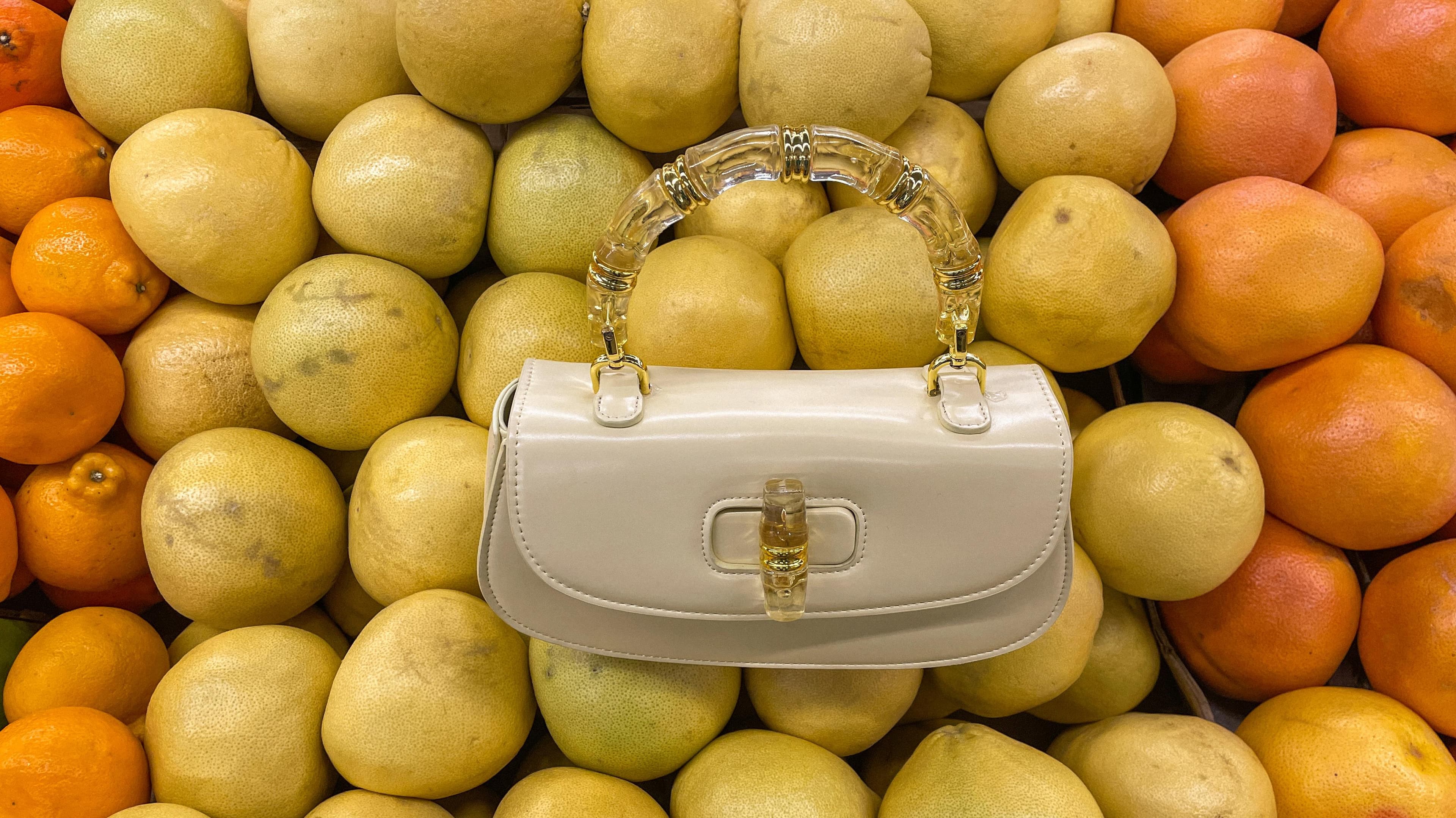 NMARTIN Butter Yellow handbag styled with citrus fruits