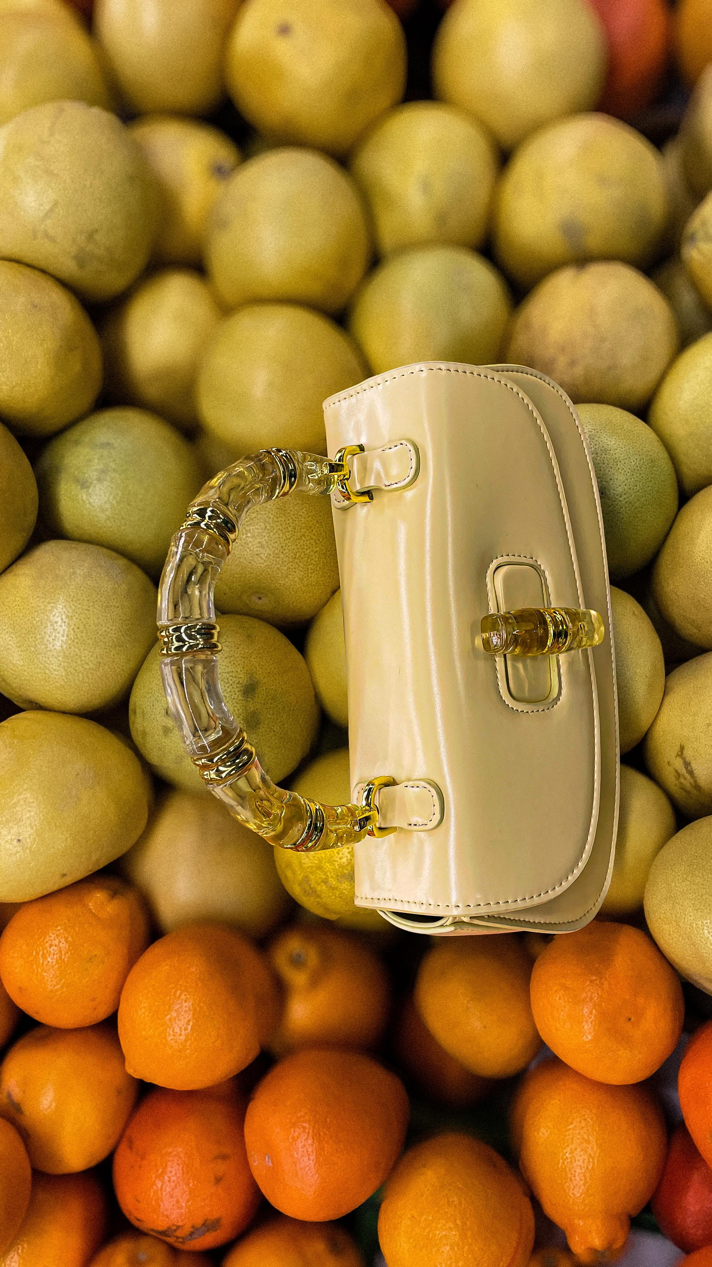 NMARTIN Butter Yellow handbag styled with citrus fruits
